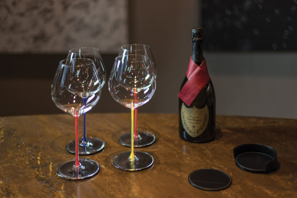 K0010XB | Bottle saver Made in Italy from genuine full grain leather, dollar grain - Bordeaux color. Dimensions: 27 x 4 x 0.5 cm.  Packaging: rigid bottom/cover Gift Box